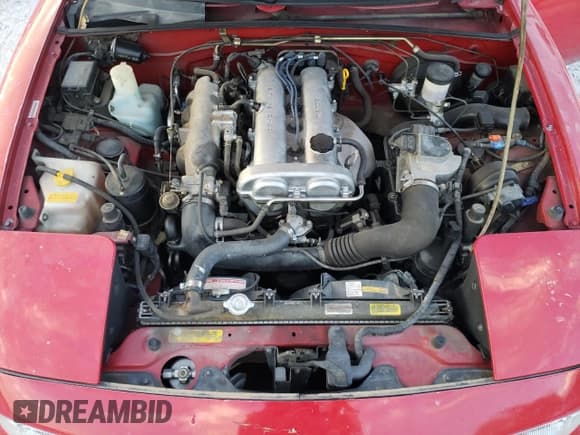 ✅ 1990 Mazda MX-5 Miata Special Edition • VIN: JM1NA3510L0110170 • Lot: 77170704. Wystawiony na Copart z przebiegiem 91 499 mil. Bezpłatny archiwum sprzedaży aukcyjnych z USA i szczegółowy raport historii pojazdu na DreamBid. Zdjęcie 11.