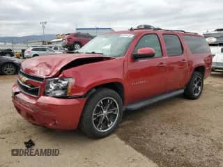 2013 Chevrolet Suburban LT with VIN 1GNSKJE77DR221506, listed as a Copart auction lot 82309425 with 189,614 mi miles and Salvage title. Bid and sale history available at DreamBid. Image 1.