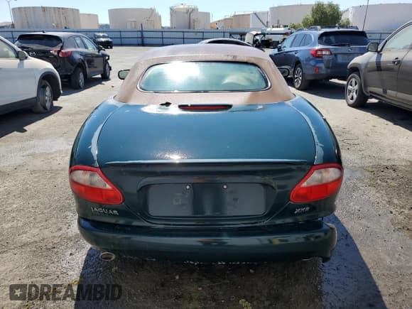 ✅ 2000 Jaguar XK • VIN: SAJJA42B5YPA06990 • Лот: 64503875. Опубликован ранее на Copart с пробегом Не указан. Бесплатный доступ к архиву аукционных продаж из США и подробный отчёт об истории автомобиля на DreamBid. Изображение 6.