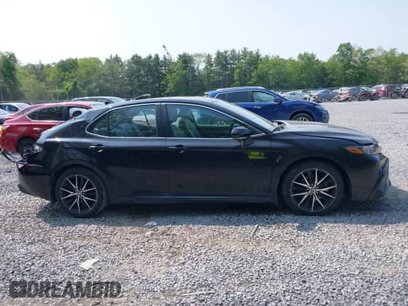 2023 Toyota Camry SE z VIN 4T1G11BKXPU101092, wystawiony jako IAAI lot #42396141 z przebiegiem 22 174 mil mil oraz . Historia ofert i sprzedaży dostępna na DreamBid. Obrazek 13.