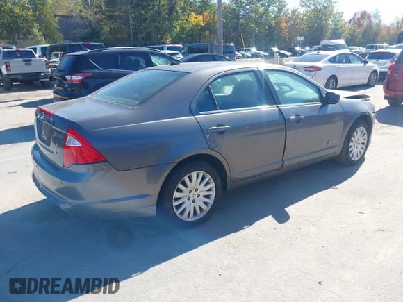 ✅ 2012 Ford Fusion Hybrid • VIN: 3FADP0L37CR221169 • Lot: 43415679. Listed on IAAI with 124,271 mi. Free auction sales archive from the USA and detailed vehicle history report at DreamBid. Image 4.