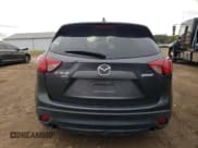 ✅ 2014 Mazda CX-5 Grand Touring • VIN: JM3KE4DY9E0368600 • Лот: 90886195. Опубликован ранее на Copart с пробегом 191 358 миль. Бесплатный доступ к архиву аукционных продаж из США и подробный отчёт об истории автомобиля на DreamBid. Изображение 6.