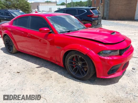✅ 2021 Dodge Charger Scat Pack Widebody • VIN: 2C3CDXGJ0MH598105 • Lot: 42556999. Listed on IAAI with 82,253 mi. Free auction sales archive from the USA and detailed vehicle history report at DreamBid. Image 1.