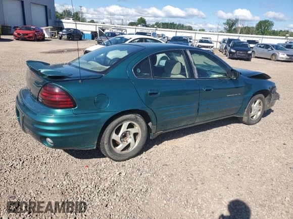 ✅ 1999 Pontiac Grand Am SE1 • VIN: 1G2NE52E6XC503882 • Lot: 64674975. Listed on Copart with 122,813 mi. Free auction sales archive from the USA and detailed vehicle history report at DreamBid. Image 3.