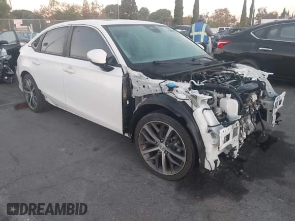 ✅ 2024 Honda Civic Touring • VIN: 2HGFE1F9XRH334103 • Лот: 43582974. Опубликован ранее на IAAI с пробегом 9 855 миль. Бесплатный доступ к архиву аукционных продаж из США и подробный отчёт об истории автомобиля на DreamBid. Изображение 1.