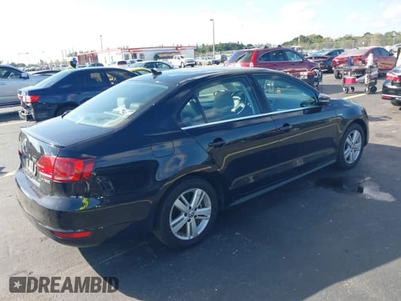 ✅ 2014 Volkswagen Jetta Hybrid • VIN: 3VW637AJ3EM219456 • Lot: 43745704. Listed on IAAI with 105,295 mi. Free auction sales archive from the USA and detailed vehicle history report at DreamBid. Image 4.