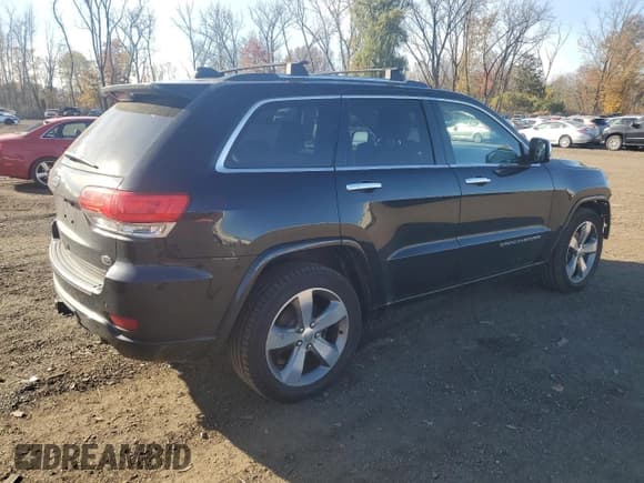 ✅ 2015 Jeep Grand Cherokee Overland • VIN: 1C4RJFCG0FC121411 • Lot: 89823465. Listed on Copart with 128,179 mi. Free auction sales archive from the USA and detailed vehicle history report at DreamBid. Image 3.