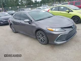 2022 Toyota Camry Hybrid XLE with VIN 4T1F31AK6NU575433, listed as a IAAI auction lot 42841689 with 65,526 mi miles and . Bid and sale history available at DreamBid. Image 1.