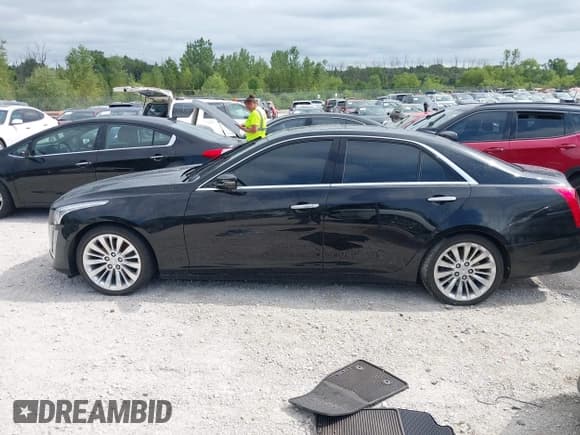 ✅ 2015 Cadillac CTS Luxury AWD • VIN: 1G6AX5SX5F0109217 • Lot: 42983192. Listed on IAAI with 54,841 mi. Free auction sales archive from the USA and detailed vehicle history report at DreamBid. Image 14.