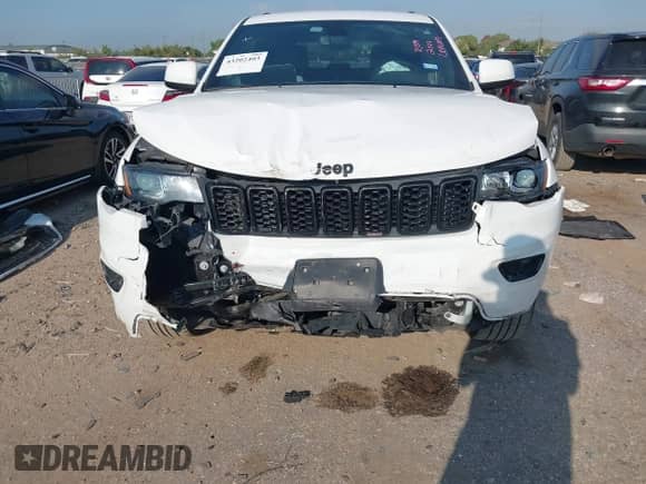 2022 Jeep Grand Cherokee Laredo E with VIN 1C4RJEAGXNC127857, listed as a IAAI auction lot 43202403 with 66,201 mi miles and . Bid and sale history available at DreamBid. Image 6.