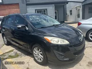 ✅ 2015 Mazda 5 Sport • VIN: JM1CW2BLXF0182880 • Лот: 59904084. Опубликован ранее на Copart с пробегом 100 383 миль. Бесплатный доступ к архиву аукционных продаж из США и подробный отчёт об истории автомобиля на DreamBid. Изображение 1.