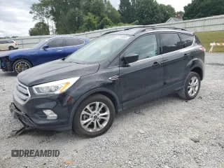 ✅ 2017 Ford Escape SE • VIN: 1FMCU0G93HUC11456 • Lot: 82309805. Listed on Copart with 60,673 mi. Free auction sales archive from the USA and detailed vehicle history report at DreamBid. Image 1.