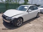 ✅ 2018 BMW 3 Series 330e • VIN: WBA8E1C5XJA180355 • Lot: 42693926. Listed on IAAI with 52,511 mi. Free auction sales archive from the USA and detailed vehicle history report at DreamBid. Image 2.