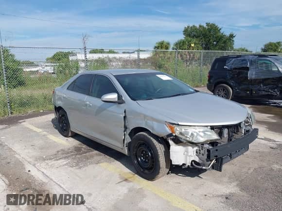 2014 Toyota Camry L with VIN 4T1BF1FK1EU765218, listed as a IAAI auction lot 43211127 with 151,964 mi miles and . Bid and sale history available at DreamBid. Image 1.