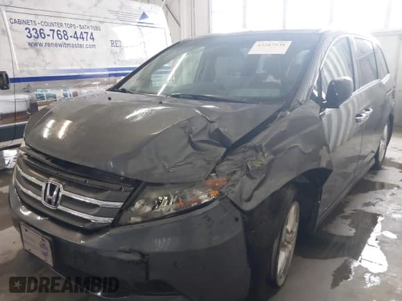✅ 2012 Honda Odyssey Touring • VIN: 5FNRL5H92CB106325 • Lot: 43287538. Listed on IAAI with 206,962 mi. Free auction sales archive from the USA and detailed vehicle history report at DreamBid. Image 6.