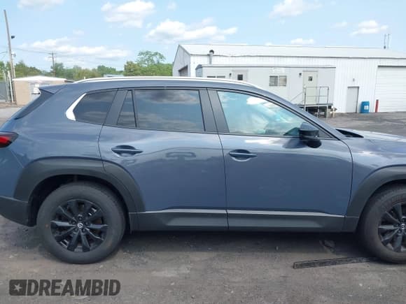 ✅ 2025 Mazda CX-50 S Premium • VIN: 7MMVABDM3SN359621 • Lot: 42402697. Listed on IAAI with 1,955 mi. Free auction sales archive from the USA and detailed vehicle history report at DreamBid. Image 13.