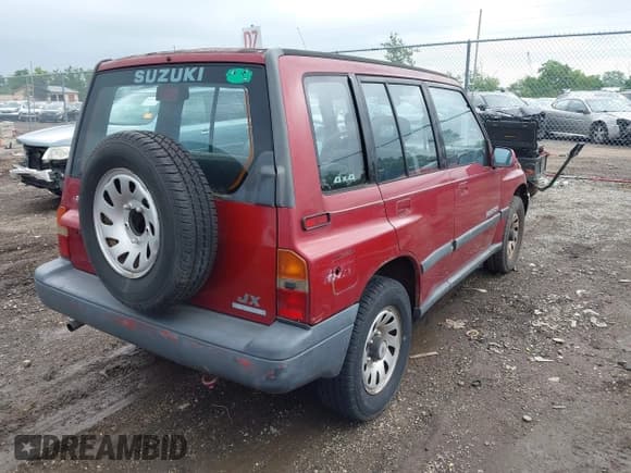 ✅ 1995 Suzuki Sidekick • VIN: JS3TD03V5S4103517 • Lot: 42523051. Listed on IAAI with 143,590 mi. Free auction sales archive from the USA and detailed vehicle history report at DreamBid. Image 4.