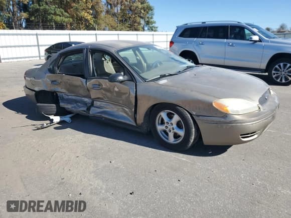 ✅ 2004 Ford Taurus SE • VIN: 1FAFP53U94A103330 • Lot: 91427105. Listed on Copart with Not provided. Free auction sales archive from the USA and detailed vehicle history report at DreamBid. Image 4.