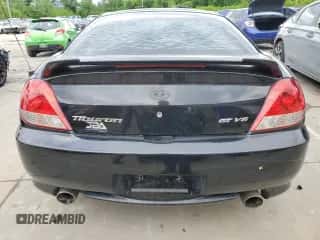 2006 Hyundai Tiburon GT z VIN KMHHN65F66U215304, wystawiony jako Copart lot #56141635 z przebiegiem 149 118 mil mil oraz Szkoda całkowita • Salvage title. Historia ofert i sprzedaży dostępna na DreamBid. Obrazek 6.
