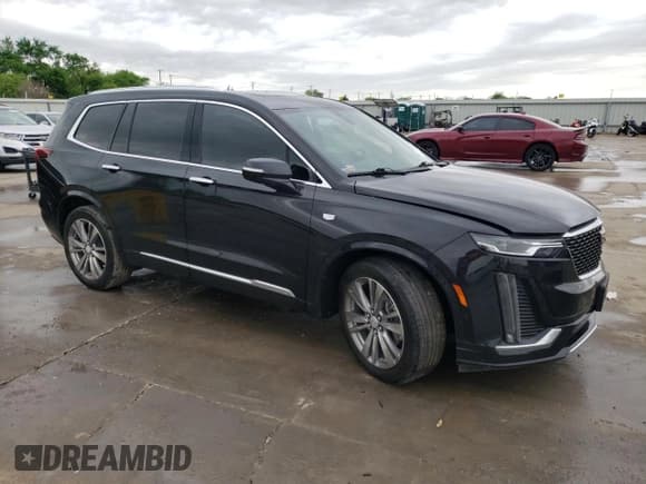 ✅ 2023 Cadillac XT6 FWD Premium Luxury • VIN: 1GYKPCRS5PZ101867 • Лот: 51773545. Опубликован ранее на Copart с пробегом 31 322 миль. Бесплатный доступ к архиву аукционных продаж из США и подробный отчёт об истории автомобиля на DreamBid. Изображение 4.