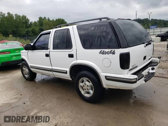 1999 Chevrolet Blazer LS z VIN 1GNDT13W9X2166733, wystawiony jako Copart lot #64965434 z przebiegiem 214 296 mil mil oraz Nie do naprawy • Non repairable. Historia ofert i sprzedaży dostępna na DreamBid. Obrazek 2.