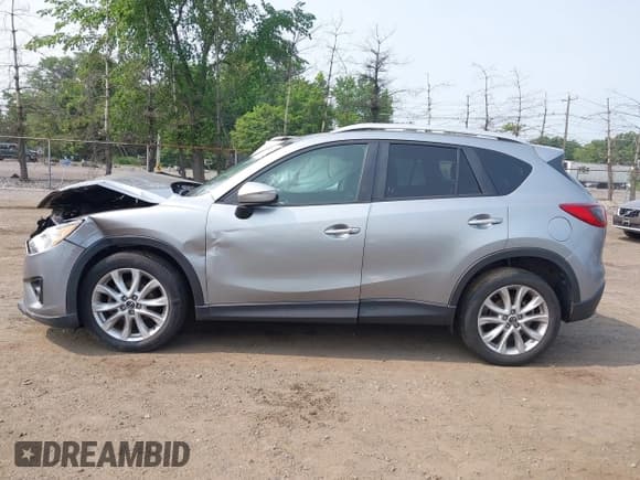 ✅ 2015 Mazda CX-5 Grand Touring • VIN: JM3KE4DY1F0530950 • Лот: 42425362. Опубликован ранее на IAAI с пробегом 120 088 миль. Бесплатный доступ к архиву аукционных продаж из США и подробный отчёт об истории автомобиля на DreamBid. Изображение 14.
