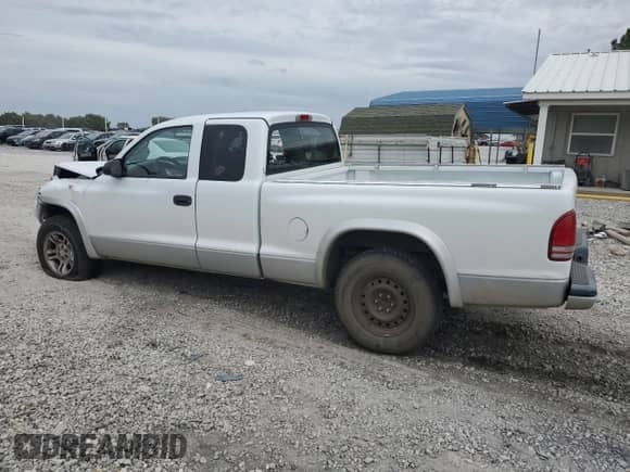 2003 Dodge Dakota SLT with VIN 1D7HL42X93S256342, listed as a Copart auction lot 80322324 with 105,049 mi miles and Salvage title. Bid and sale history available at DreamBid. Image 2.