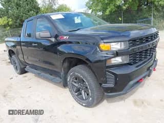 2019 Chevrolet Silverado 1500 Custom Trail Boss z VIN 1GCRYCEF0KZ412920, wystawiony jako IAAI lot #43065107 z przebiegiem 119 067 mil mil oraz . Historia ofert i sprzedaży dostępna na DreamBid. Obrazek 1.