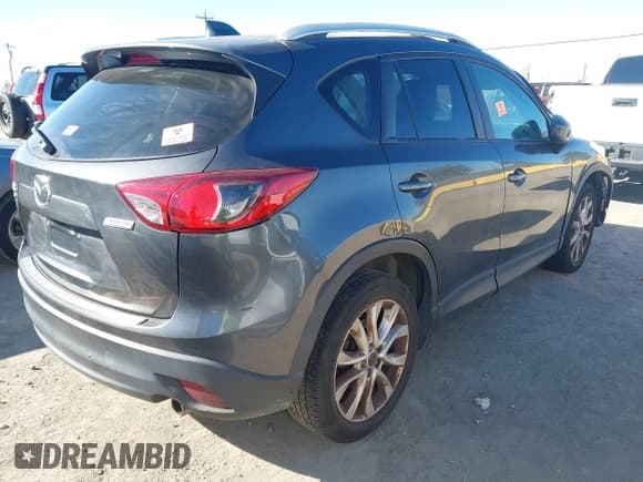 ✅ 2014 Mazda CX-5 Grand Touring • VIN: JM3KE4DY0E0355217 • Lot: 43433154. Listed on IAAI with 166,232 mi. Free auction sales archive from the USA and detailed vehicle history report at DreamBid. Image 4.