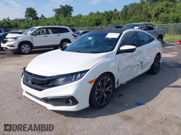 ✅ 2019 Honda Civic Sport • VIN: 19XFC2F84KE002922 • Лот: 43153785. Опубликован ранее на IAAI с пробегом 117 204 миль. Бесплатный доступ к архиву аукционных продаж из США и подробный отчёт об истории автомобиля на DreamBid. Изображение 2.