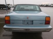 ✅ 1986 Oldsmobile 88 • VIN: 1G3HY6931G1848954 • Lot: 81999144. Wystawiony na Copart z przebiegiem Nie podano. Bezpłatny archiwum sprzedaży aukcyjnych z USA i szczegółowy raport historii pojazdu na DreamBid. Zdjęcie 6.