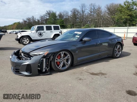 ✅ 2024 Audi e-tron GT Premium Plus • VIN: WAUFJBFWXR7003987 • Лот: 59656755. Опубликован ранее на Copart с пробегом 7 397 миль. Бесплатный доступ к архиву аукционных продаж из США и подробный отчёт об истории автомобиля на DreamBid. Изображение 1.