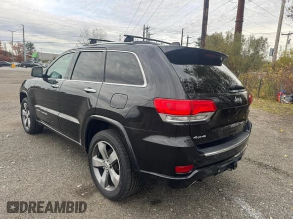 ✅ 2015 Jeep Grand Cherokee Overland • VIN: 1C4RJFCG2FC754749 • Lot: 92074455. Listed on Copart with 193,496 mi. Free auction sales archive from the USA and detailed vehicle history report at DreamBid. Image 4.