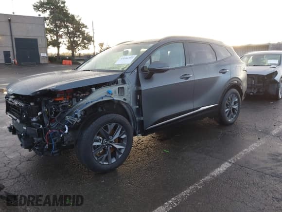 ✅ 2023 Kia Sportage SX-Prestige • VIN: KNDPXCAG9P7055572 • Лот: 43586302. Опубликован ранее на IAAI с пробегом 21 700 миль. Бесплатный доступ к архиву аукционных продаж из США и подробный отчёт об истории автомобиля на DreamBid. Изображение 2.