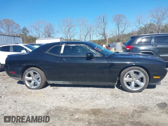 ✅ 2014 Dodge Challenger SXT • VIN: 2C3CDYAG1EH229824 • Lot: 41749410. Listed on IAAI with 103,079 mi. Free auction sales archive from the USA and detailed vehicle history report at DreamBid. Image 13.