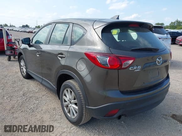 ✅ 2016 Mazda CX-5 Sport • VIN: JM3KE4BY5G0610675 • Lot: 43212213. Listed on IAAI with 234,292 mi. Free auction sales archive from the USA and detailed vehicle history report at DreamBid. Image 3.