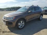 ✅ 2013 Volkswagen Touareg Lux • VIN: WVGEF9BP6DD013932 • Lot: 62047945. Listed on Copart with 127,821 mi. Free auction sales archive from the USA and detailed vehicle history report at DreamBid. Image 1.