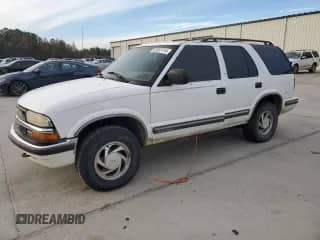 1999 Chevrolet Blazer LT with VIN 1GNDT13W1X2163194, listed as a Copart auction lot 82897414 with Not provided miles and Salvage title. Bid and sale history available at DreamBid. Image 1.