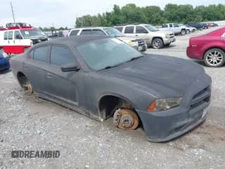 ✅ 2013 Dodge Charger Police • VIN: 2C3CDXAG0DH592298 • Lot: 42915752. Listed on IAAI with 173,725 mi. Free auction sales archive from the USA and detailed vehicle history report at DreamBid. Image 1.