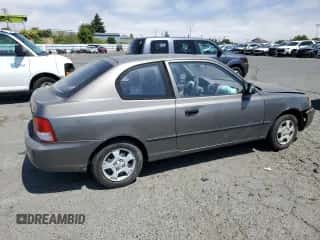 2002 Hyundai Accent z VIN KMHCF35G32U206522, wystawiony jako Copart lot #62509445 z przebiegiem 147 183 mil mil oraz Szkoda całkowita • Salvage title. Historia ofert i sprzedaży dostępna na DreamBid. Obrazek 3.