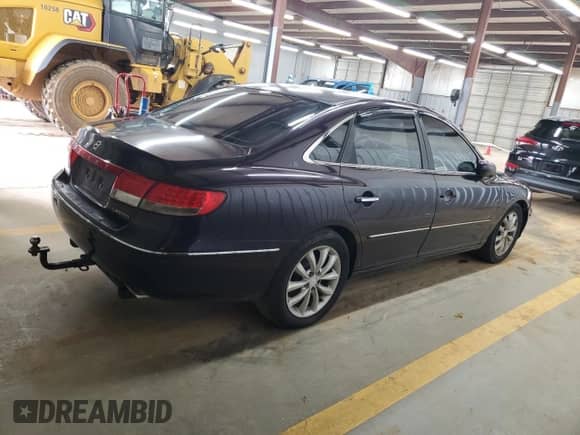2006 Hyundai Azera SE с VIN KMHFC46F36A096628, выставлен на аукционе Copart как лот 61042145 с пробегом 229 357 миль миль и Списание • Salvage title. История ставок и продаж доступна на DreamBid. Изображение 3.