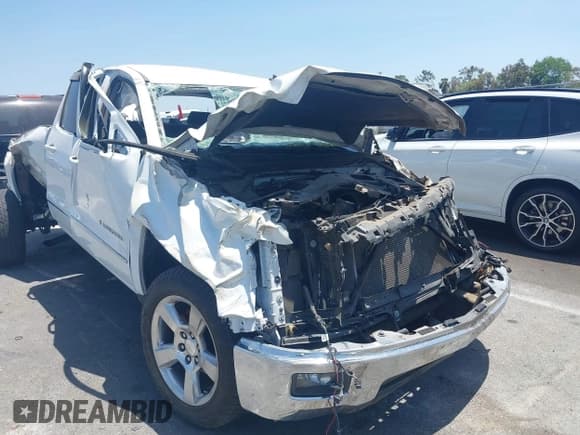 ✅ 2014 Chevrolet Silverado 1500 LT • VIN: 1GCRCREC7EZ239733 • Lot: 42338192. Listed on IAAI with 112,907 mi. Free auction sales archive from the USA and detailed vehicle history report at DreamBid. Image 1.