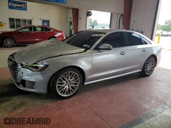 ✅ 2016 Audi A6 Premium • VIN: WAUFFAFC1GN124742 • Lot: 68173615. Listed on Copart with 115,675 mi. Free auction sales archive from the USA and detailed vehicle history report at DreamBid. Image 1.