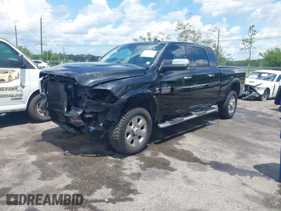 ✅ 2016 Ram 2500 Laramie • VIN: 3C6UR5NL3GG197024 • Lot: 42527161. Listed on IAAI with 147,290 mi. Free auction sales archive from the USA and detailed vehicle history report at DreamBid. Image 2.