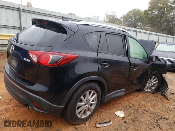 ✅ 2016 Mazda CX-5 Touring • VIN: JM3KE2CY3G0876747 • Lot: 90040135. Listed on Copart with 99,927 mi. Free auction sales archive from the USA and detailed vehicle history report at DreamBid. Image 3.