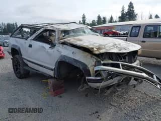 1998 Chevrolet Tahoe z VIN 3GNEK18R7WG112413, wystawiony jako IAAI lot #42886060 z przebiegiem 203 908 mil mil oraz . Historia ofert i sprzedaży dostępna na DreamBid. Obrazek 1.