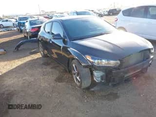 2019 Hyundai Veloster Premium z VIN KMHTG6AF5KU013252, wystawiony jako IAAI lot #41313753 z przebiegiem 63 323 mil mil oraz . Historia ofert i sprzedaży dostępna na DreamBid. Obrazek 1.