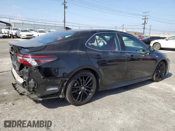 2021 Toyota Camry Hybrid XSE с VIN 4T1K31AK5MU549676, выставлен на аукционе Copart как лот 81924375 с пробегом 83 653 миль миль и Списание • Salvage title. История ставок и продаж доступна на DreamBid. Изображение 3.