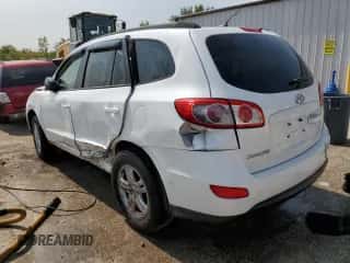 2012 Hyundai Santa Fe GLS z VIN 5XYZG3AB5CG134120, wystawiony jako Copart lot #70640204 z przebiegiem Nie podano mil oraz Szkoda całkowita • Salvage title. Historia ofert i sprzedaży dostępna na DreamBid. Obrazek 2.