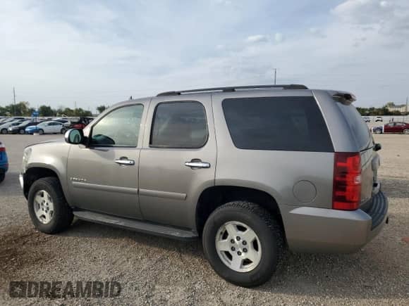 2007 Chevrolet Tahoe LS z VIN 1GNEC13J27J127383, wystawiony jako Copart lot #84521875 z przebiegiem 246 578 mil mil oraz Szkoda całkowita • Salvage title. Historia ofert i sprzedaży dostępna na DreamBid. Obrazek 2.